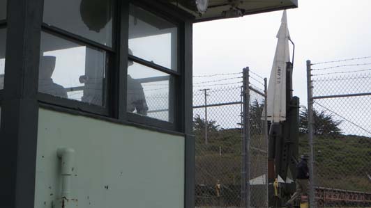 Guard shack and missile in launch position.