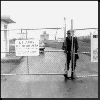 M.P. behind closed gate at entrance to Nike launch site