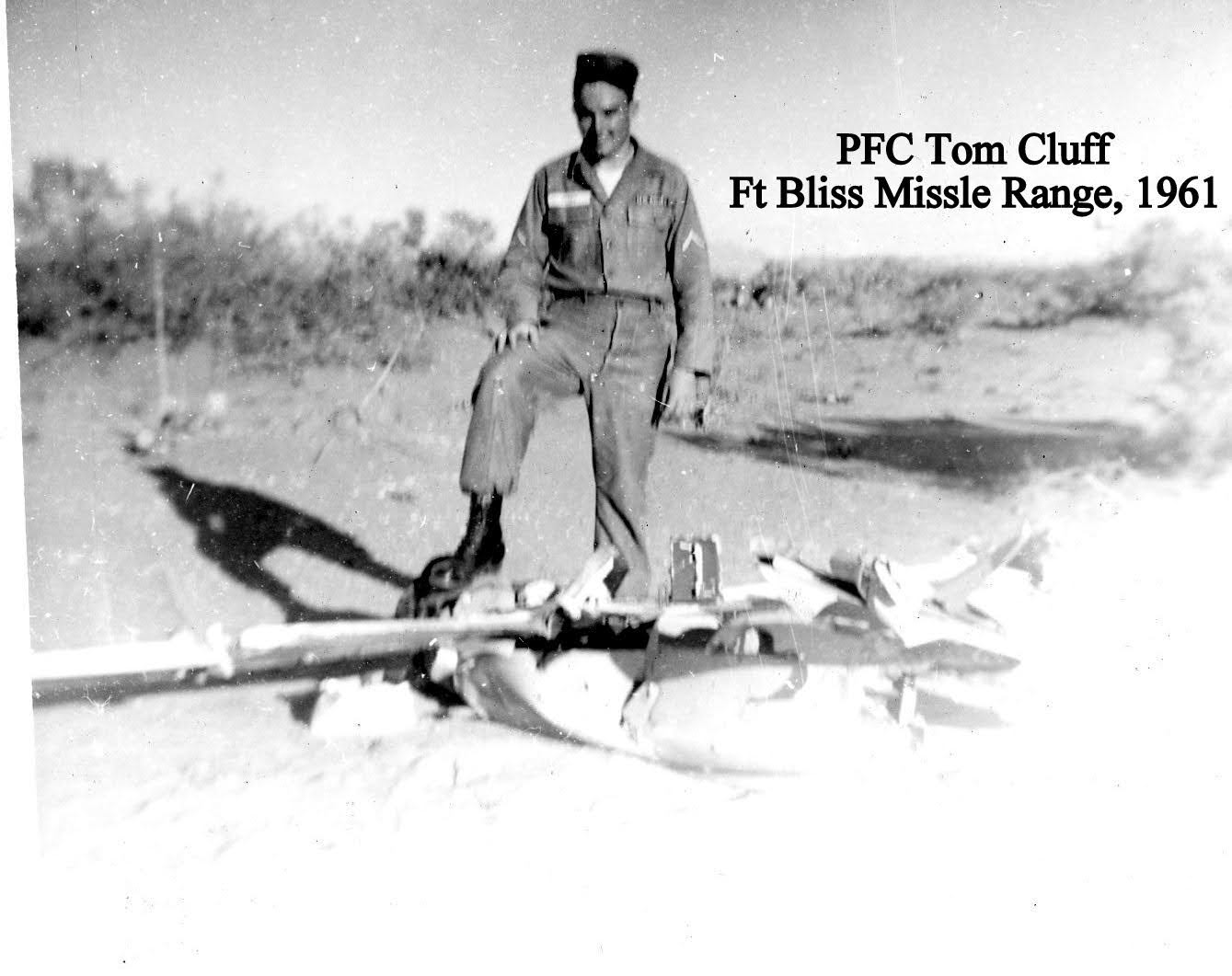 Tom Cluff stands in desert with remains of remote controlled aerial target